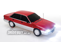 
              Holden VL Calais Sedan 1/24 - DDA Spectra Rides Light Up - Red Silver
            