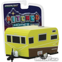 
              1958 Siesta Travel Trailer Caravan 1/64 – GreenLight Diecast – Yellow/Brown
            