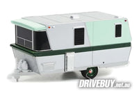 
              1962 Holiday House Travel Trailer Caravan 1/64 – GreenLight Diecast – Mint/Silver
            