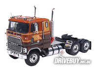 
              1976 Ford CL9000 COE Semi Truck 1/64 - IXO Diecast - Brown Tan Gold
            