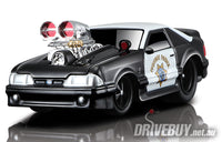 
              1993 Ford Mustang SVT Cobra Highway Patrol 1/64 – Muscle Machines – Black/White
            